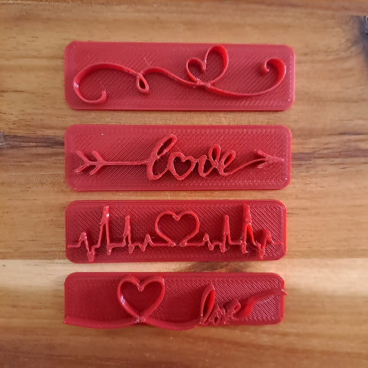 Set 4pz. stampi Love - San Valentino - Tagliabiscotti - Formina - per biscotti o decorazioni torte in pasta di zucchero - Misura 5/6 cm circa Set 4pz. stampi Love - San Valentino - Tagliabiscotti - Formina - per biscotti o decorazioni torte in pasta di zucchero - Misura 5/6 cm circa